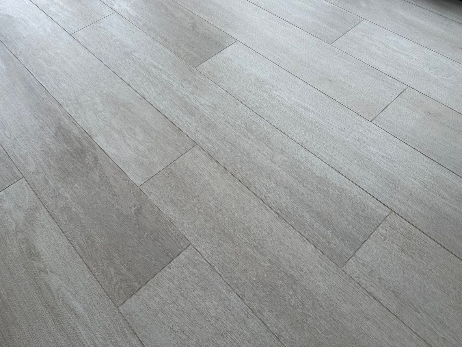 Luxury vinyl plank and tile flooring installation with clean transitions